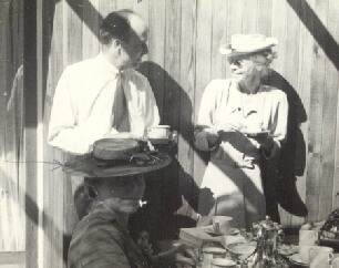 Grace Flather (seated front) with Artist Jack Shadbolt behind her at BC Binnings West Vancouver home in the 1940's at an Annual Federation of Canadian Artists party.